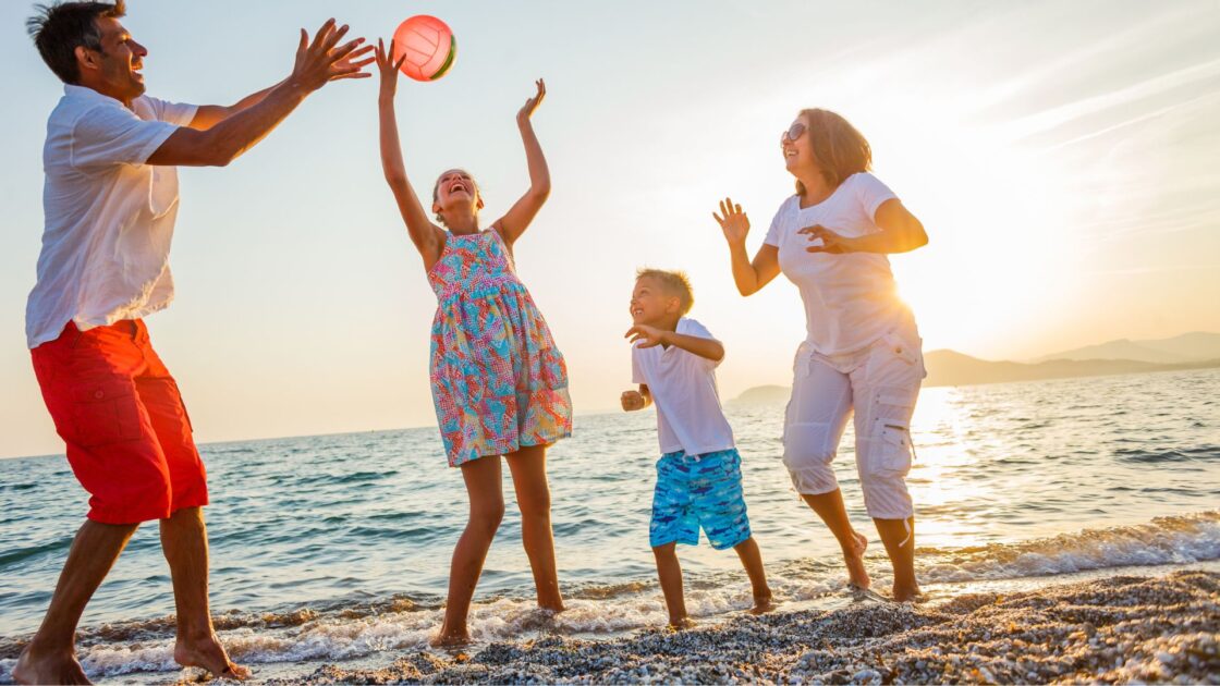 summer fam on beach stock
