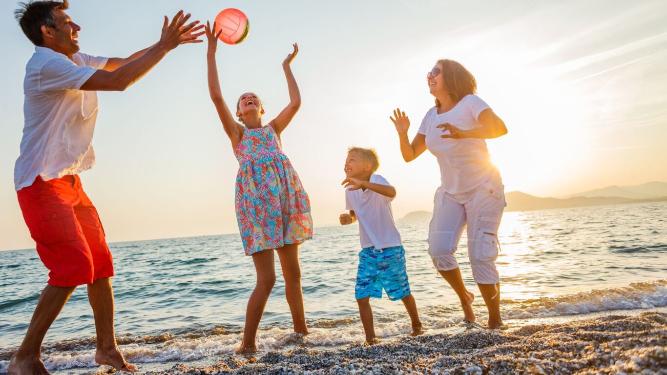 summer fam on beach stock